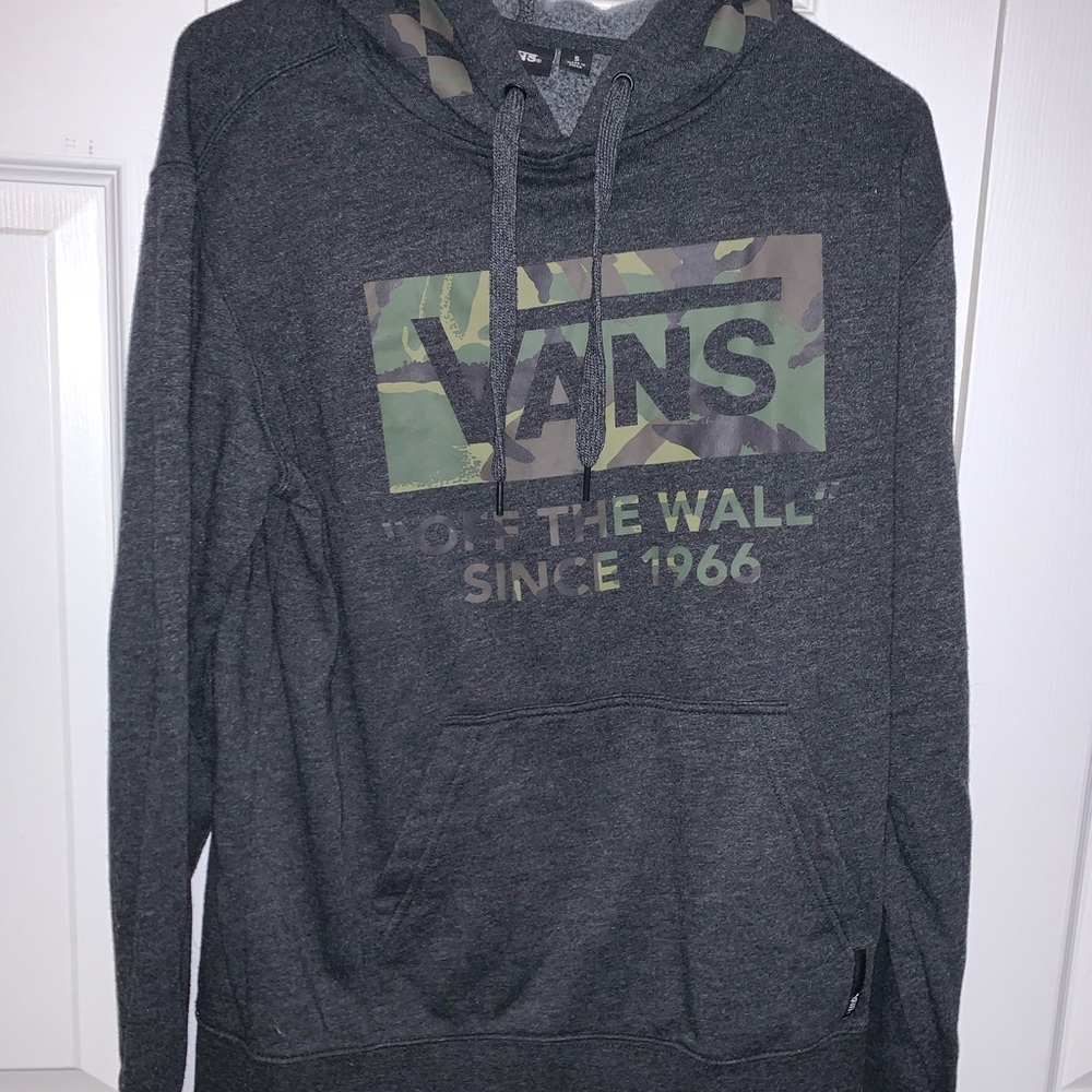 Soft Gray and camo vans pull over.